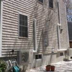 A house with two windows and a door.